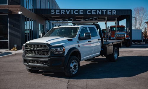 9’4” CM RD FLATBED • CUSTOM FABRICATED MATERIAL RACK • UNDER BODY TOOL BOXES
